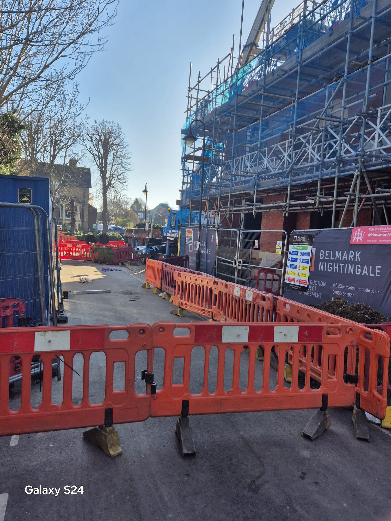 Traffic management barriers enclosing a construction site within a road closure