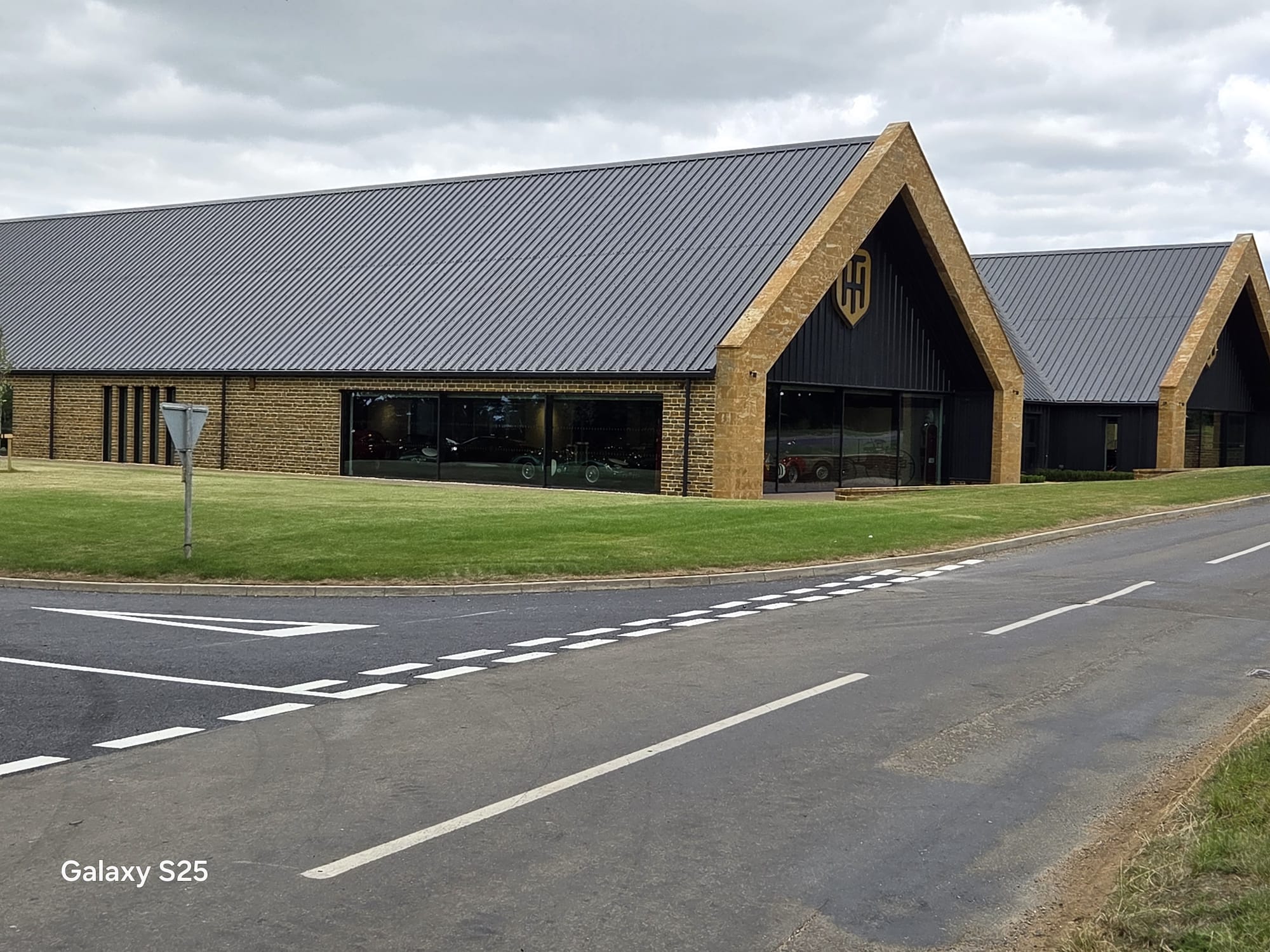 Finished venue development with completed carriageway markings and access road