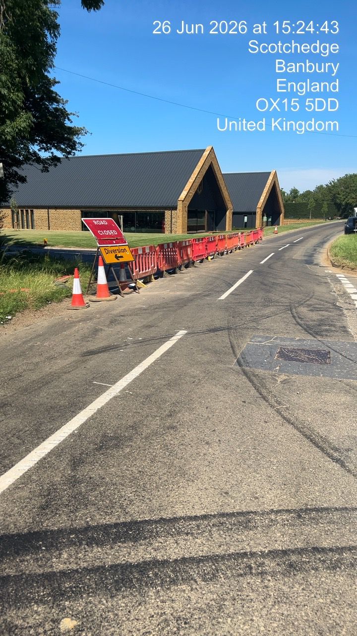 Barrier line and cones protecting construction works alongside a rural carriageway