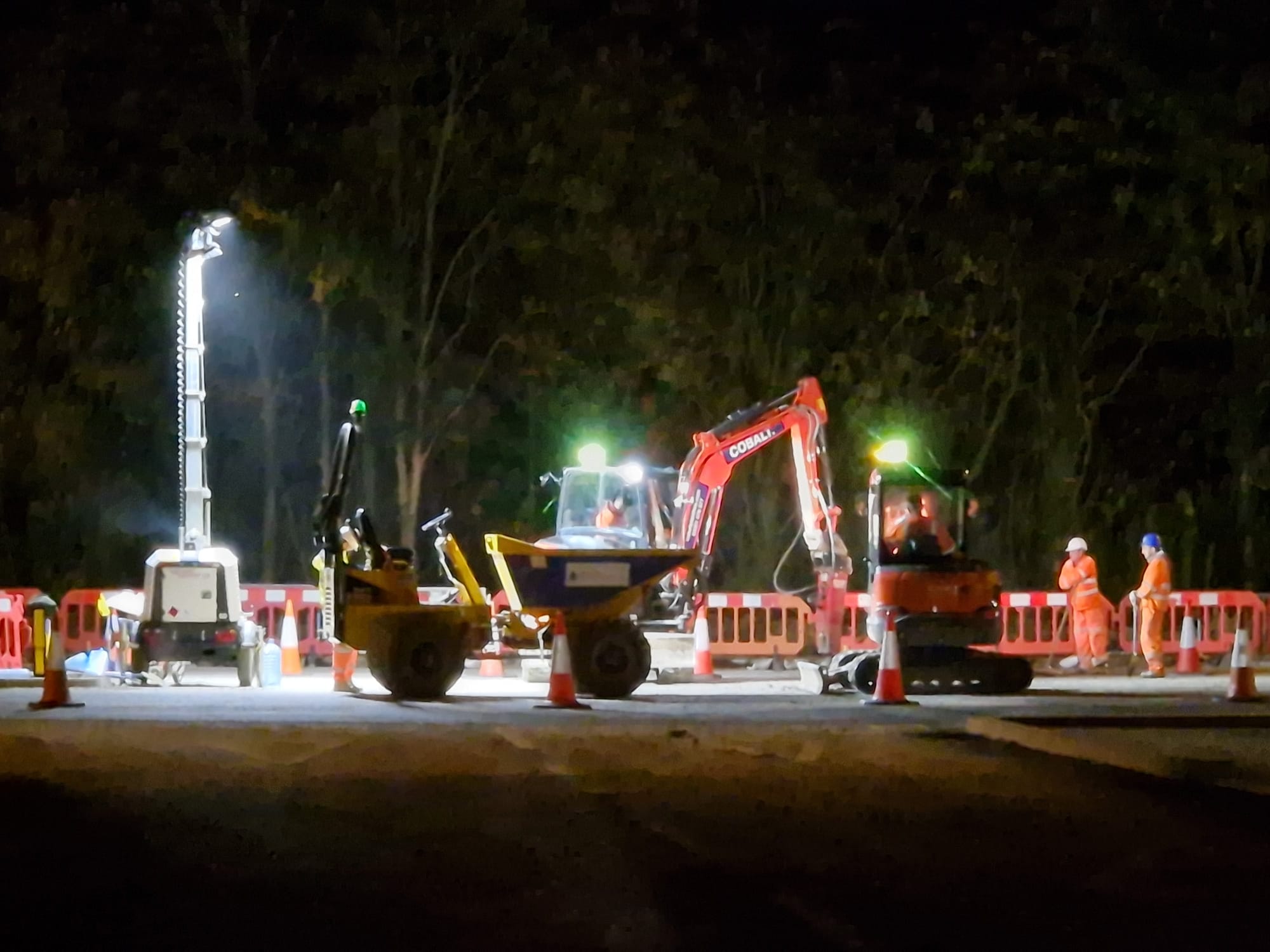 Excavation work carried out under floodlights during out-of-hours night works
